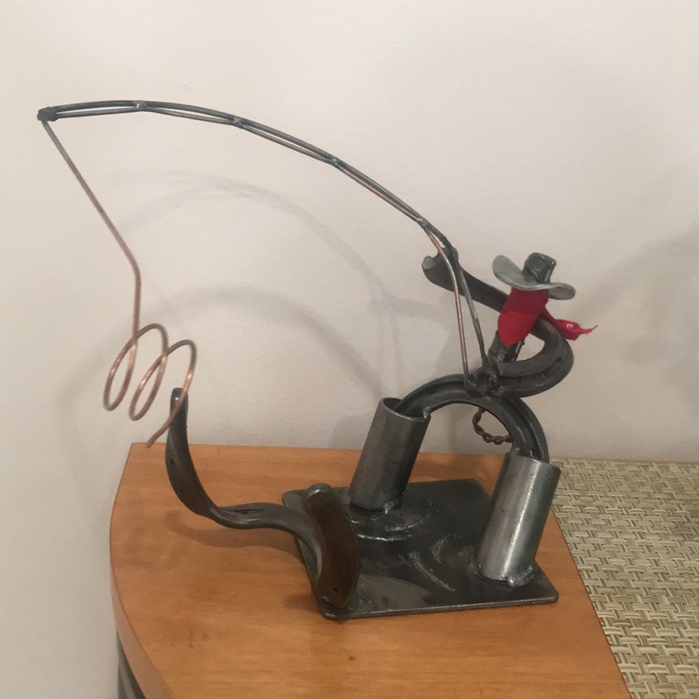 Horseshoe metal cowboy decor/bottle holder